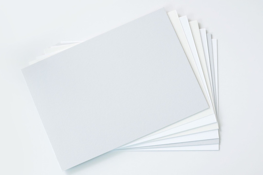 How to Choose the Right Paper and Finishes for Your Print Project 1 Different paper stock options on white background