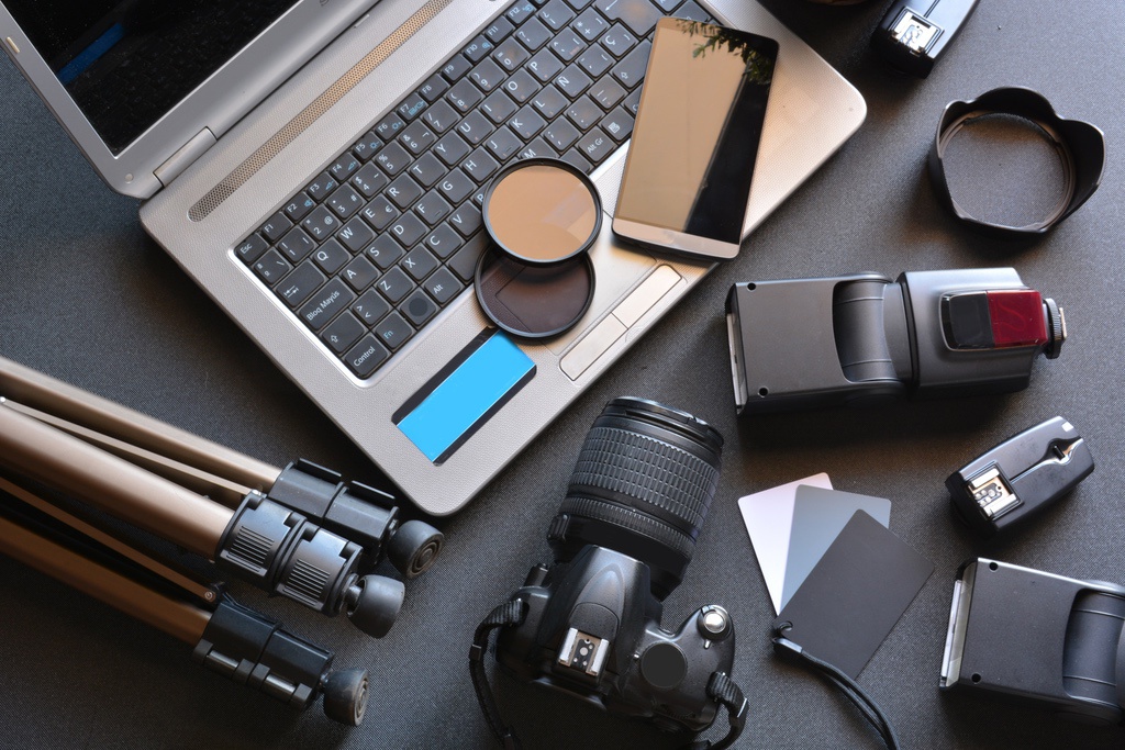 Turn Your Original Artwork Into an Online Store Like Etsy 1 Laptop surrounded by photography gear to represent artist digitizing their work to sell online