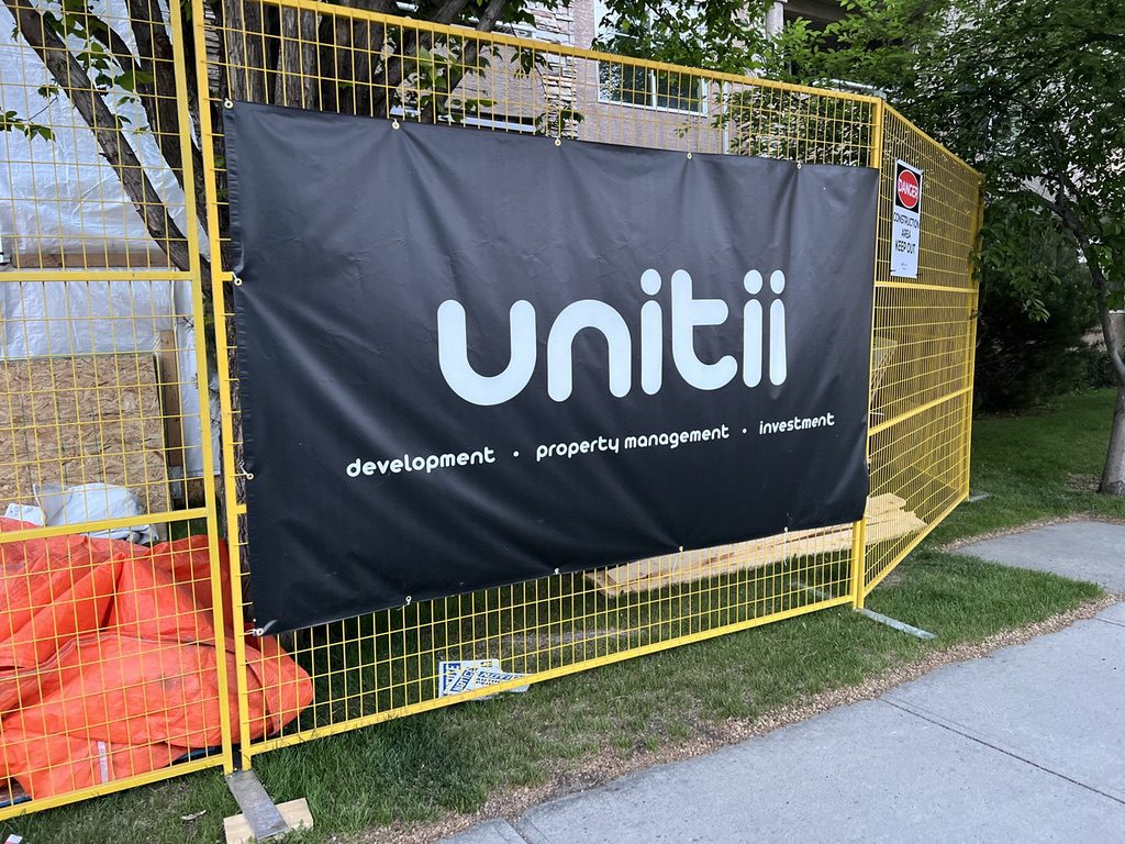 Banner printed by Little Rock on fence